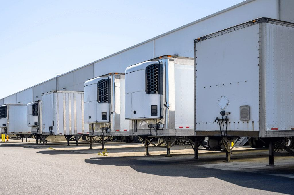 Trailers spotted at warehouse dock doors